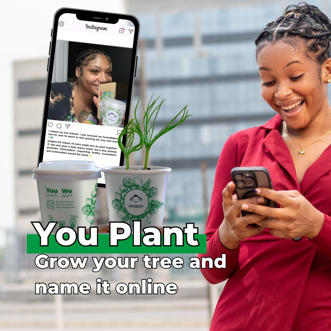 Person engaging with tree planting app on phone.